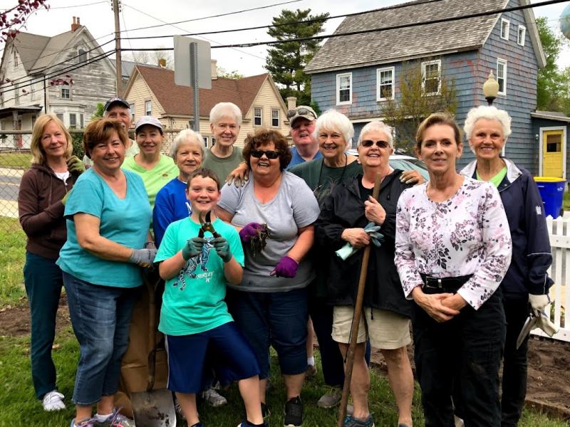 Taking a break from planting are Milton Garden Club members and friends in back (l-r) Barbara Sandifer, Milton Community Foundation President Steve Crawford, Shelley Paine, Louise Huntley and Art Winterbottom. In the middle are Gillian Benson, Sue Toccafondi, Sandy Winterbottom, Kathryn Greig, Pat Greninger and Joan Turci. In front are Declan Gallagher, a Shields fifth-grader and the club’s youngest volunteer, and Mary Ellen King. SUBMITTED PHOTOS